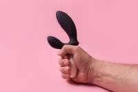 the-dildo-in-hand-on-a-pink-background-sex-toy360749-160.jpg